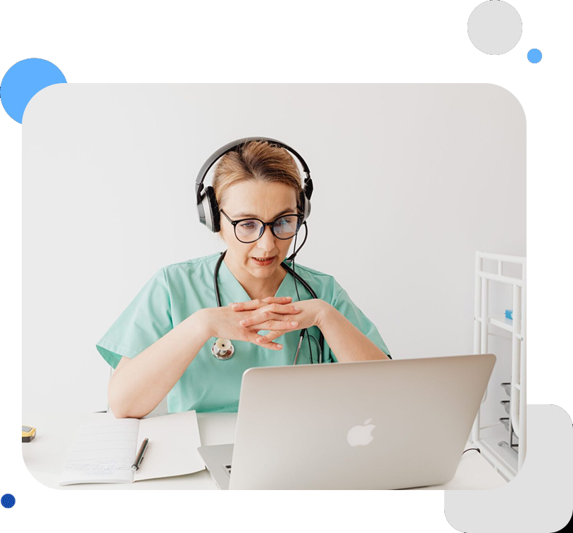 A person with headphones on sitting at a table